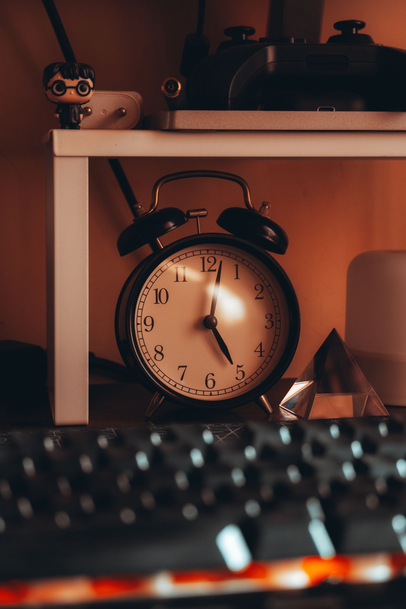Light reflecting on the glass of a desk alarm clock