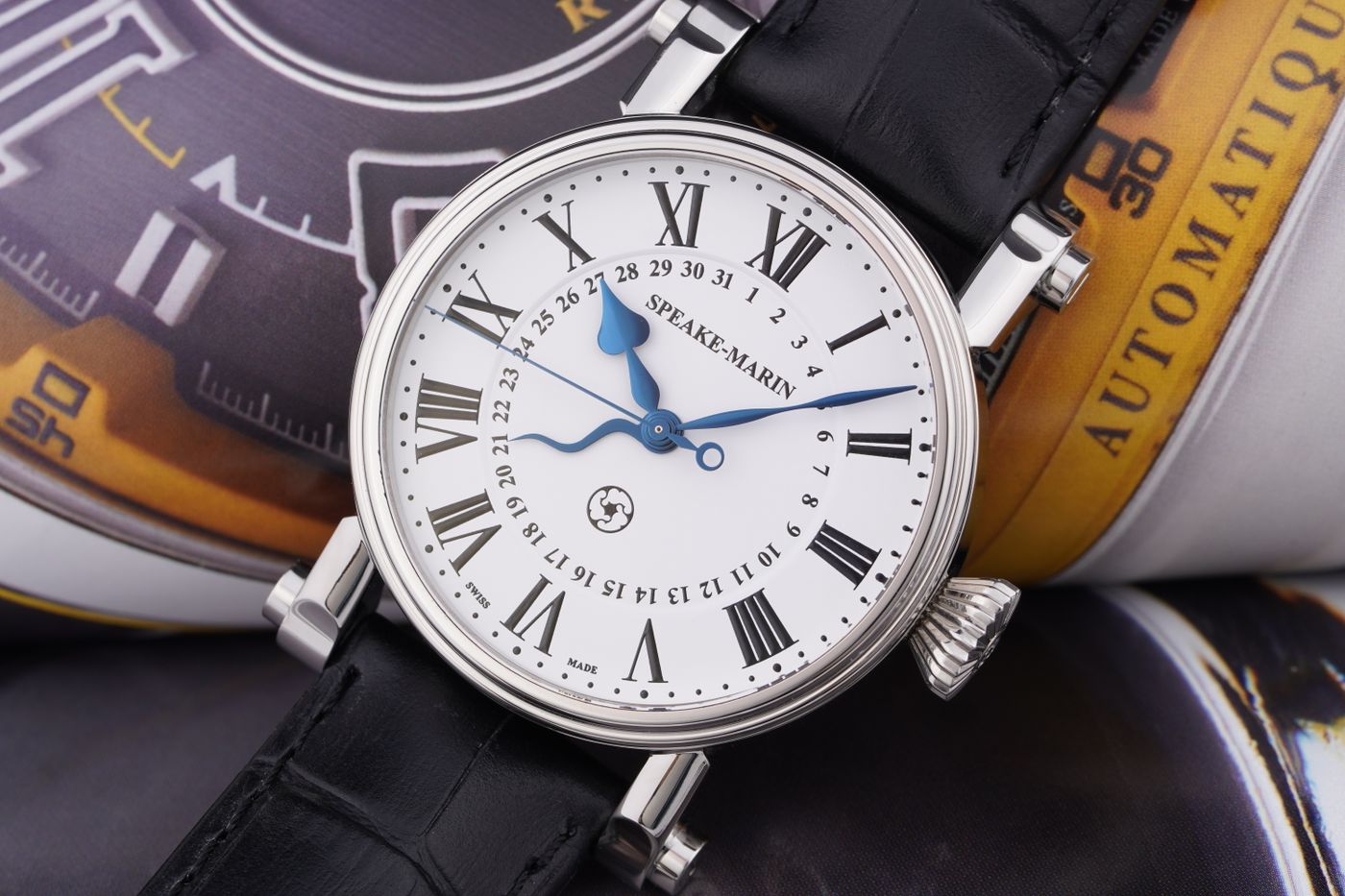 A close view of a wristwatch face and leather strap